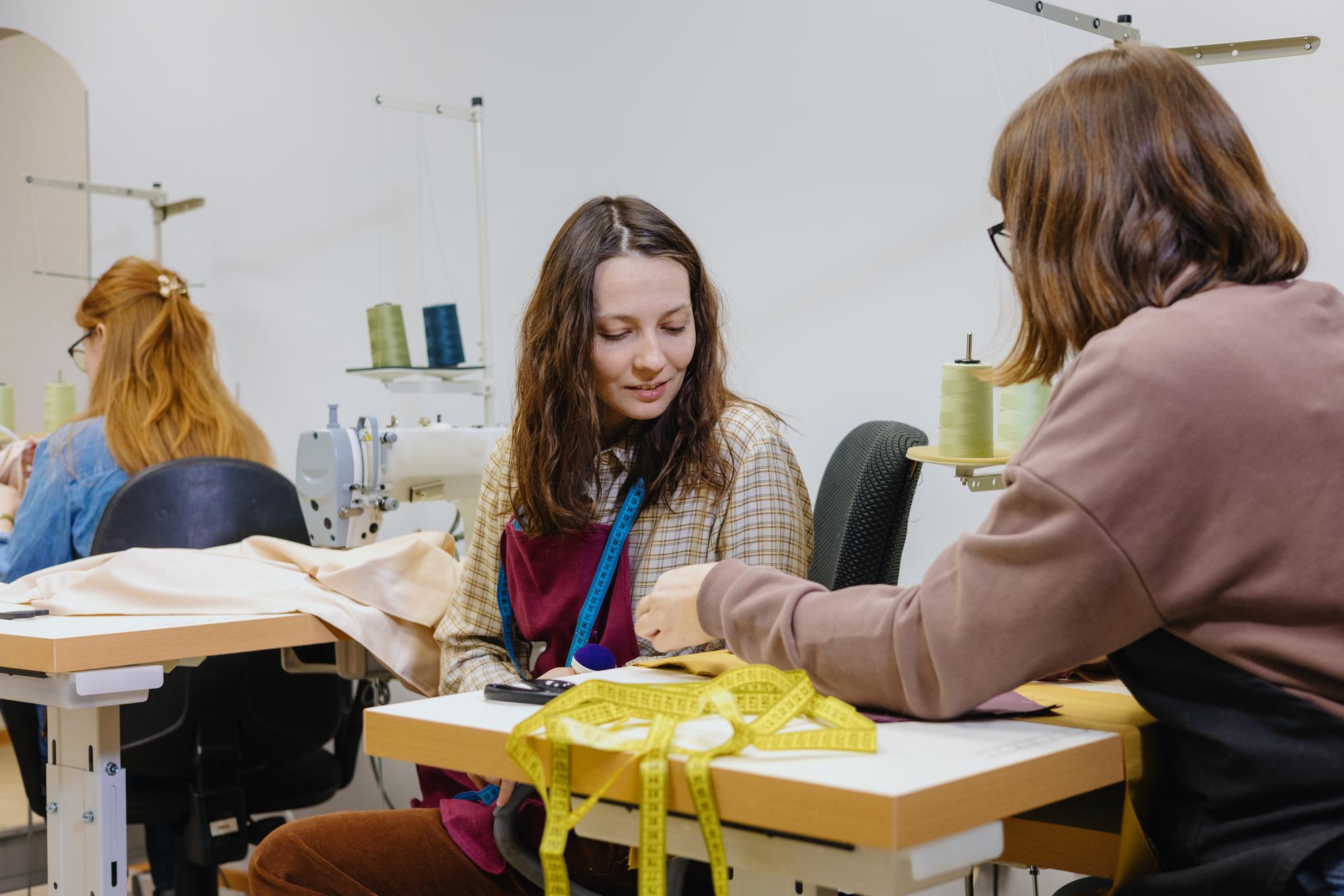 workshop instructor demonstrating embroidery technique